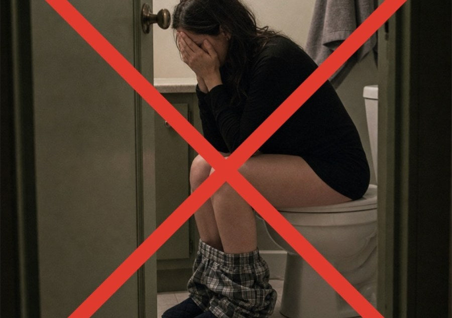 A woman sitting on the toilet with her head in her hands, crossed out in red, showing what a harsh laxative cleanse feels like