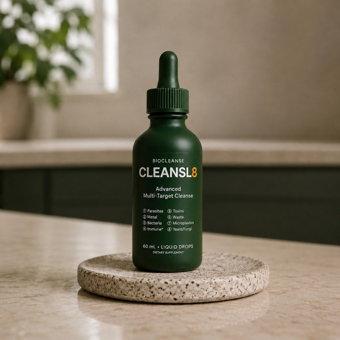 The CLEANSL8 bottle standing on a stone dish on a kitchen counter